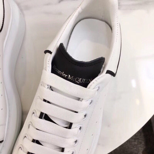 Side profile of Alexander McQueen two-tone sneakers breathable knit upper