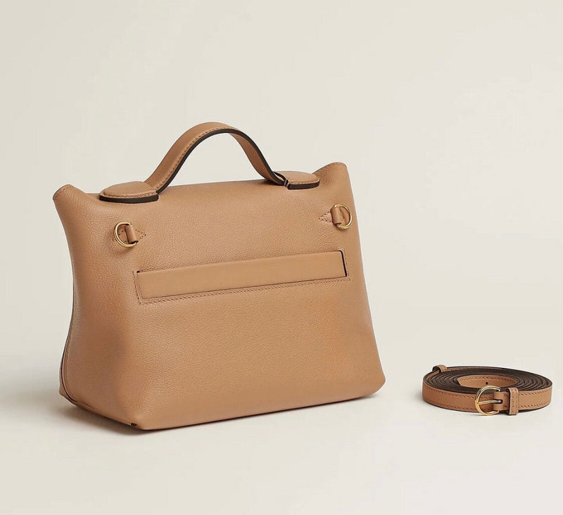 Side view of tailored structured handbag