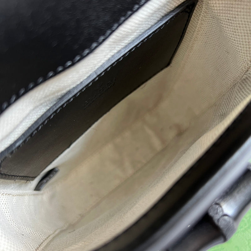 Close-up detail of elevated structured women's handbag – women's designer-style accessory