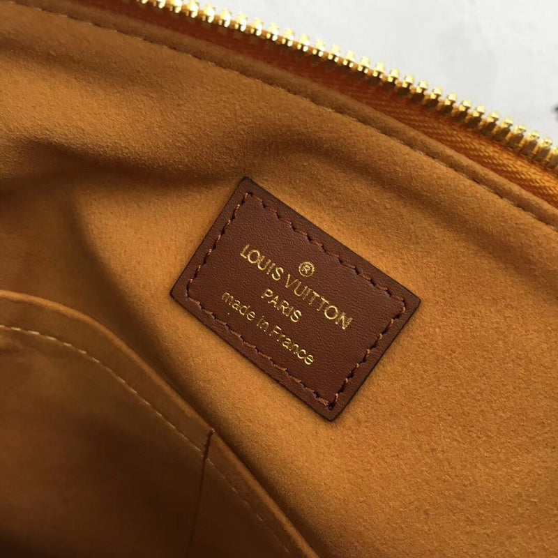 Side profile of sleek premium women's handbag – women's designer-style accessory