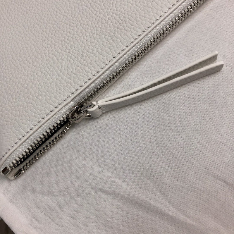 Back view of modern refined women's handbag – women's statement bag
