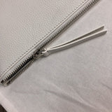 Back view of modern refined women's handbag – women's statement bag