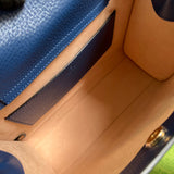 Side profile of structured elevated women's handbag – women's statement bag