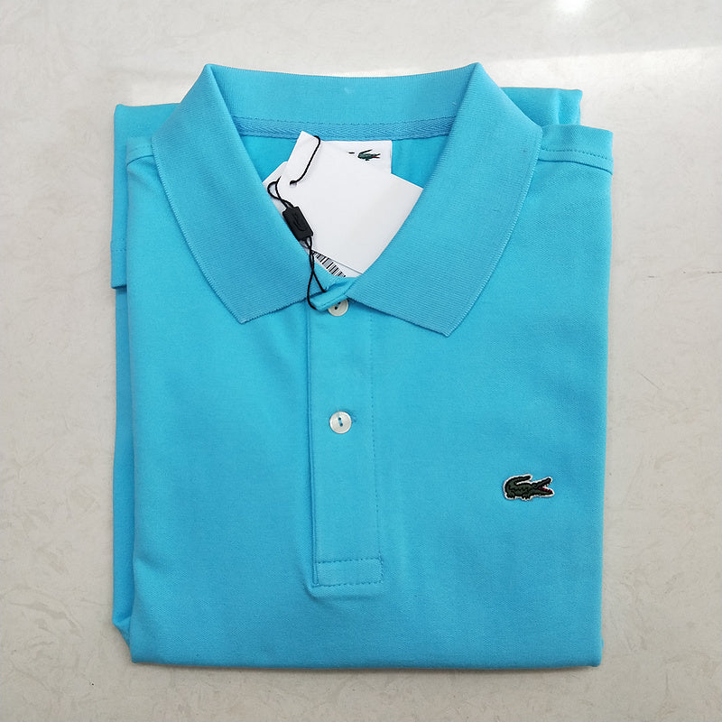 Flat lay presentation of Lacoste luxury clothing with monogram-inspired silhouette