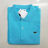 Flat lay presentation of Lacoste luxury clothing with monogram-inspired silhouette