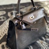  Statement tote bag carried on shoulder