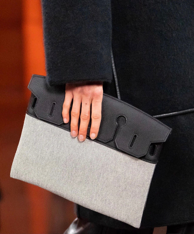 Side view of fluid structured handbag