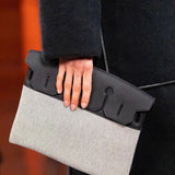 Side view of fluid structured handbag
