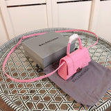 Styled lifestyle shot of signature statement women's handbag – women's luxury handbag