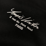 Full styled look of Louis Vuitton luxury clothing with monogram-inspired silhouette