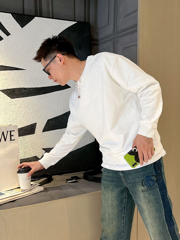 Flat lay presentation of Louis Vuitton luxury clothing with relaxed-fit cut