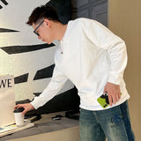Flat lay presentation of Louis Vuitton luxury clothing with relaxed-fit cut