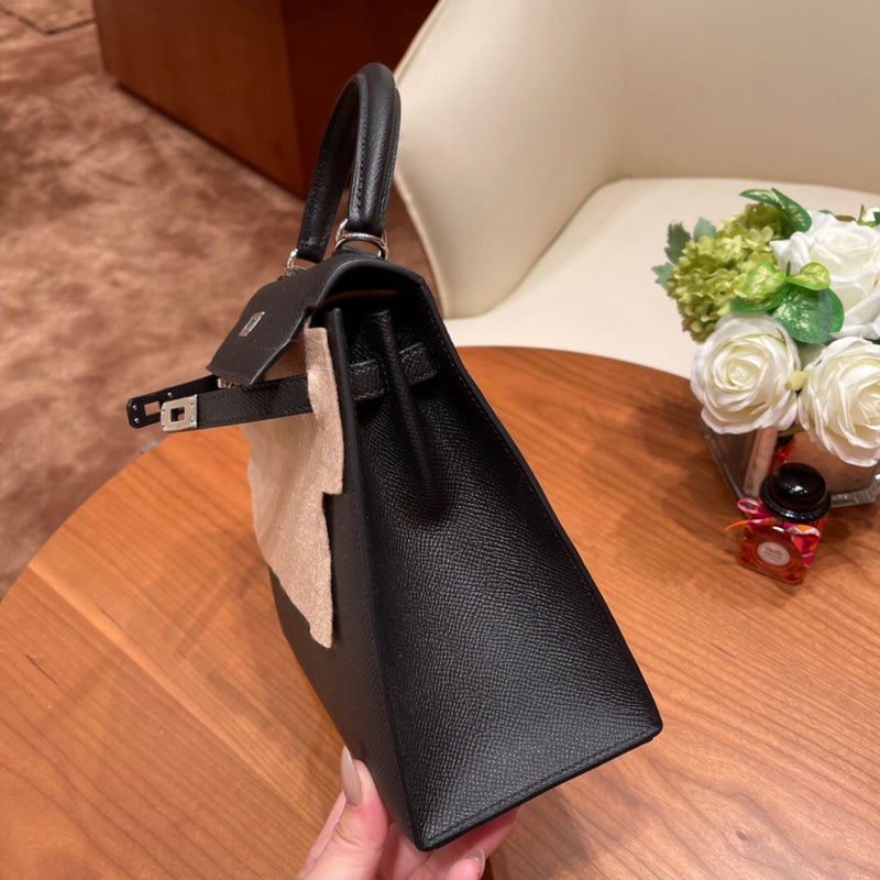 Side view of understated structured handbag