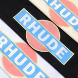 Close-up detail shot of Rhude luxury clothing with label-forward styling