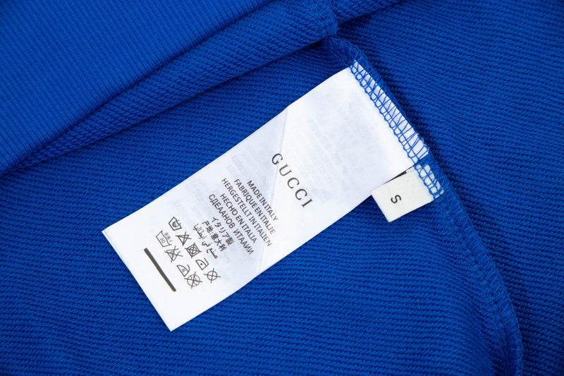 Close-up detail shot of Gucci luxury clothing with tailored silhouette