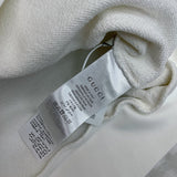 Close-up detail shot of Gucci luxury clothing with monogram-inspired silhouette