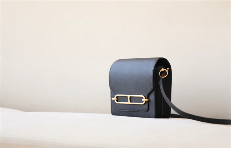  Understated crossbody bag carried on shoulder