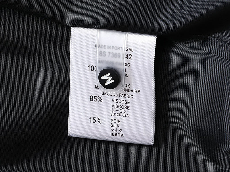 Side profile of Louis Vuitton luxury clothing with signature branding