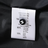 Side profile of Louis Vuitton luxury clothing with signature branding