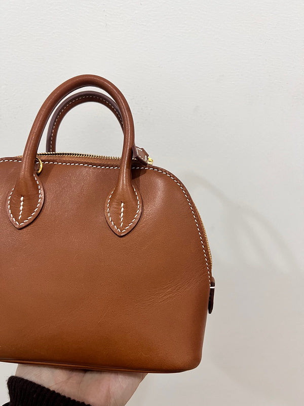 Side view of structured structured handbag
