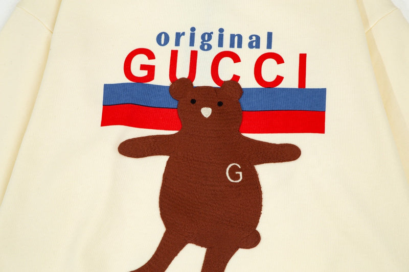 Flat lay presentation of Gucci luxury clothing with everyday silhouette