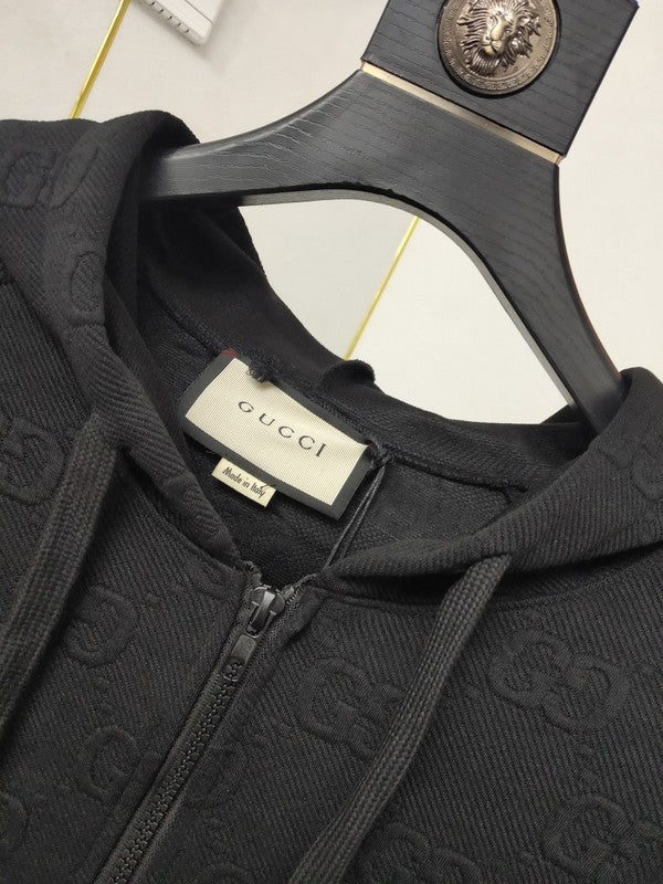 Close-up detail shot of Gucci luxury clothing with label-forward styling