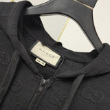 Close-up detail shot of Gucci luxury clothing with label-forward styling