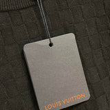 Side profile of Louis Vuitton luxury clothing with label-forward styling