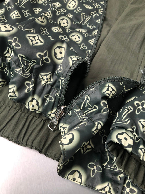 Flat lay presentation of Louis Vuitton luxury clothing with signature branding