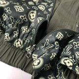Flat lay presentation of Louis Vuitton luxury clothing with signature branding