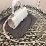 Handle and strap detail of everyday-luxe premium women's handbag – women's premium purse