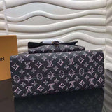 Styled lifestyle shot of modern statement women's handbag – women's luxury accessory