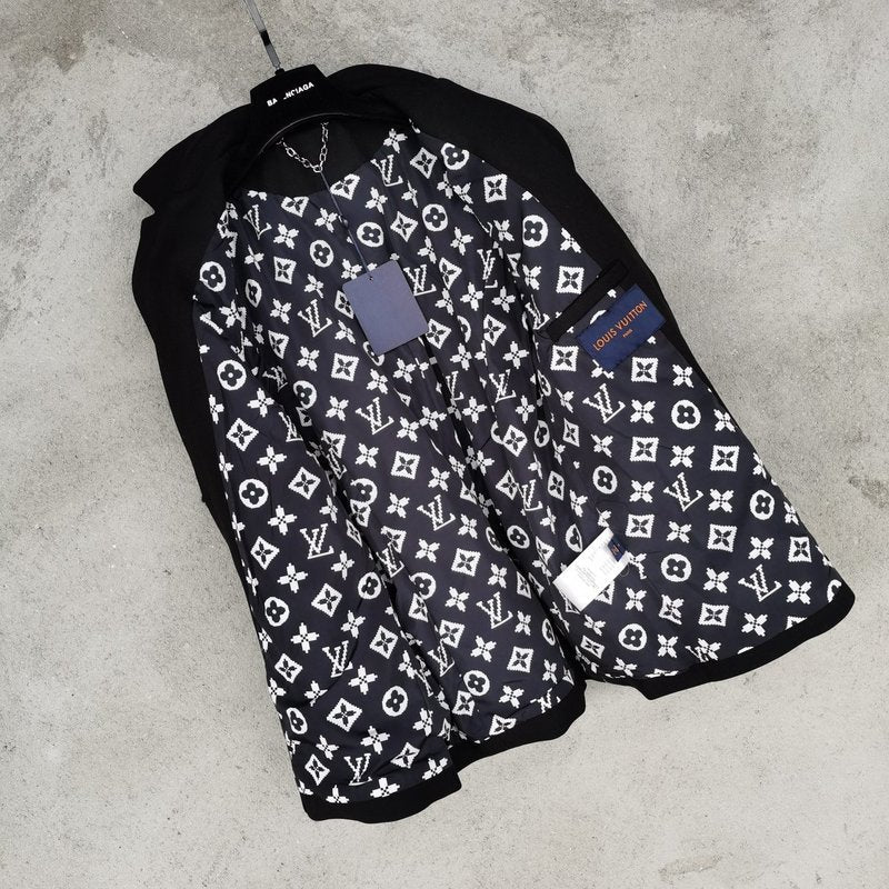 Close-up detail shot of Louis Vuitton luxury clothing with logo-detail design