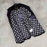 Close-up detail shot of Louis Vuitton luxury clothing with logo-detail design