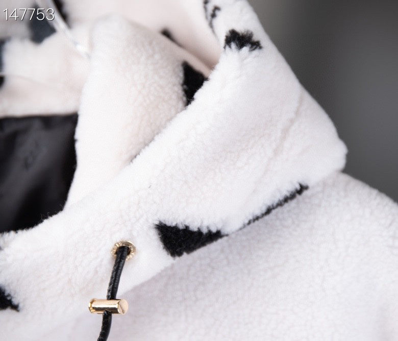 Flat lay presentation of Louis Vuitton luxury clothing with signature branding