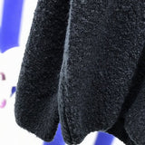 Close-up detail shot of Louis Vuitton luxury clothing with relaxed-fit cut