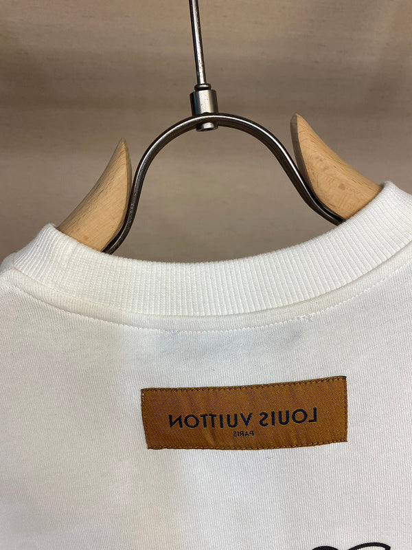 Close-up detail shot of Louis Vuitton cotton t-shirt with signature branding