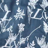 Side profile of Louis Vuitton luxury clothing with signature branding
