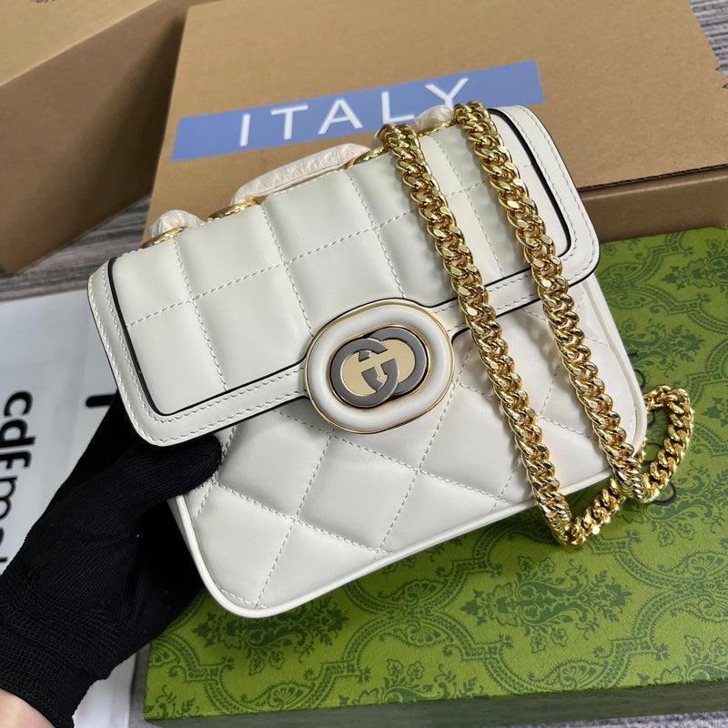Handle and strap detail of classic polished women's handbag – women's statement bag