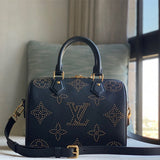  Refined top-handle bag carried on shoulder