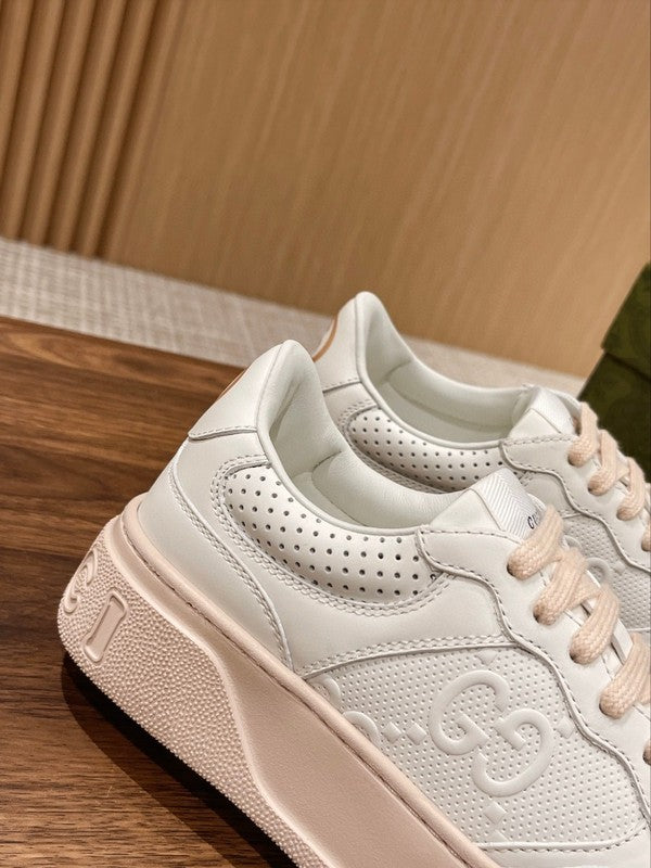 Side profile of Gucci neutral cream sneakers breathable knit upper