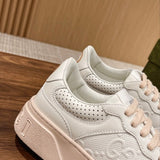 Side profile of Gucci neutral cream sneakers breathable knit upper