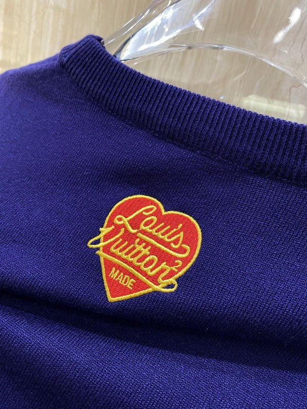 Close-up detail shot of Louis Vuitton luxury clothing with runway-inspired design