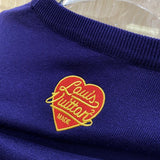 Close-up detail shot of Louis Vuitton luxury clothing with runway-inspired design