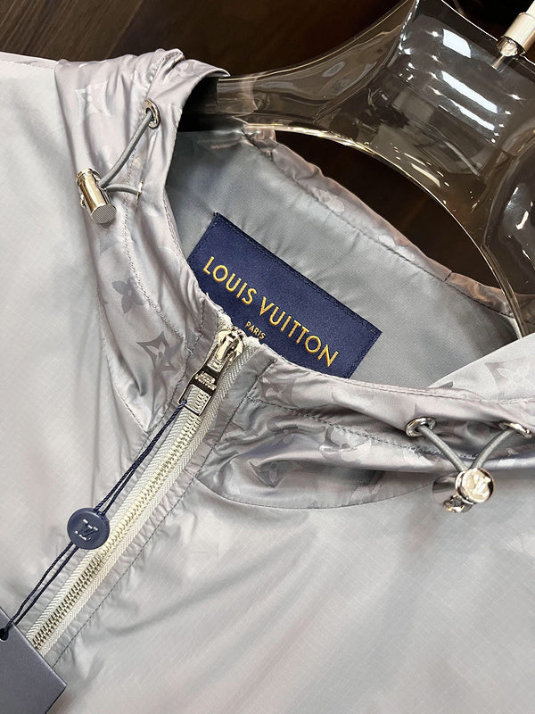Flat lay presentation of Louis Vuitton luxury clothing with label-forward styling