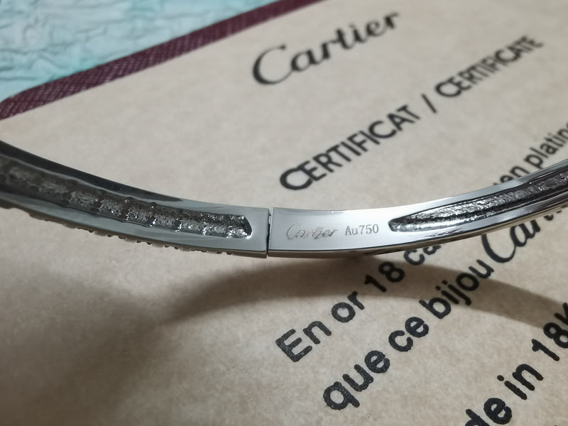 Side view of Cartier unisex jewelry piece