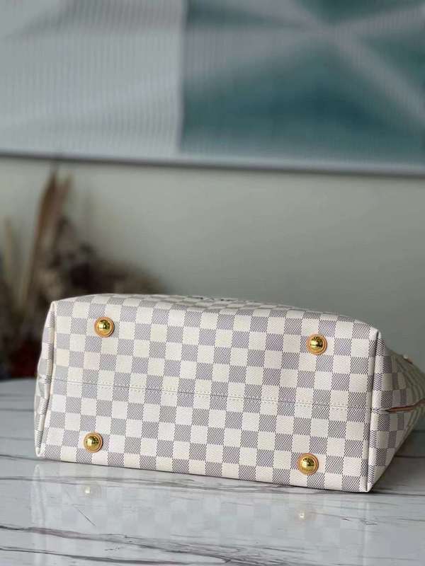 Styled lifestyle shot of polished elevated women's handbag – women's luxury handbag