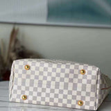 Styled lifestyle shot of polished elevated women's handbag – women's luxury handbag