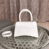 Styled lifestyle shot of premium refined women's handbag – women's statement bag