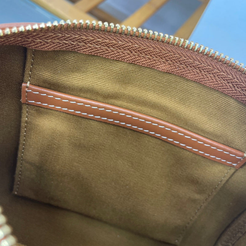 Handle and strap detail of sleek refined women's handbag – women's designer-style accessory